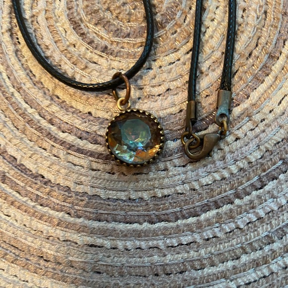 Swarovski pendant on black waterproof cord with gold lobster claw closure. - Picture 2 of 3